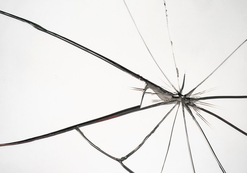 Crushed,Glass.,Window,With,Cracks.,Mirror,Was,Broken,Due,To