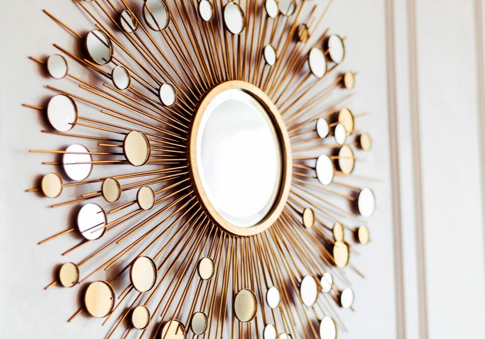 A,Stylish,Decorative,Mirror,With,A,Gold,Frame,,Designed,With