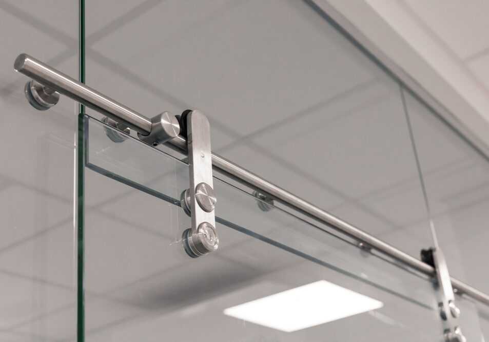 Close-up,View,Of,Sleek,Glass,Sliding,Door,Hardware,Showcasing,A