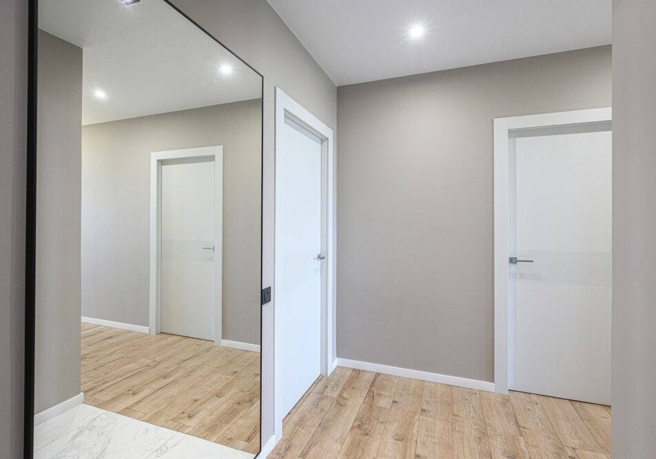 Modern,Hallway,With,Light,Grey,Walls,,Light,Wooden,Flooring,,White